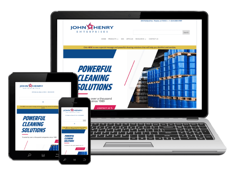 A laptop, tablet, and smartphone display the John Henry Enterprises website homepage, which features industrial barrels and the text "Powerful Cleaning Solutions.
